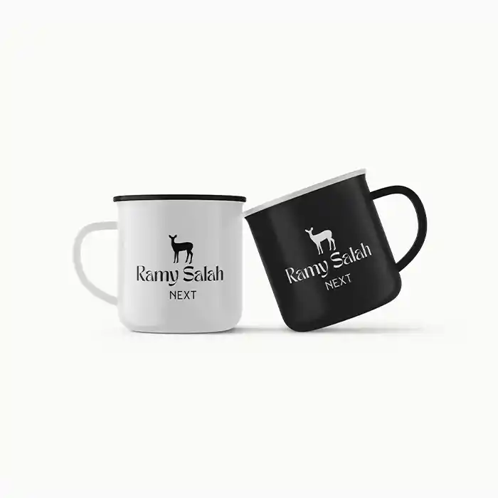 كوبين سيراميك أبيض وأسود مطبوع عليهما شعار رامي صلاح | Black and white ceramic mugs printed with Ramy Salah logo