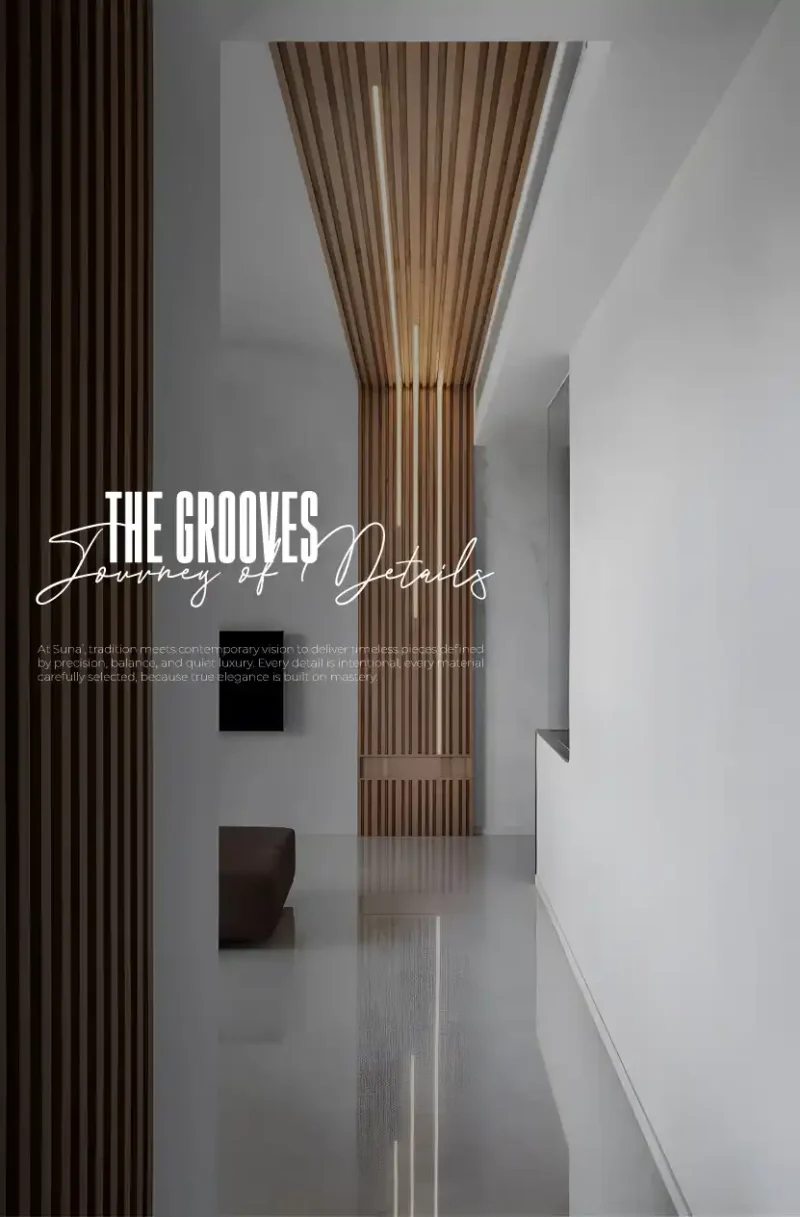 ممر طويل بتصميم عصري يجمع بين الجدران البيضاء النقية والأعمدة الخشبية الطولية مع إضاءة مدمجة في مشروع "The Grooves" - تنفيذ وكالة رامي صلاح Modern corridor design featuring pure white walls and vertical wood paneling with integrated lighting for "The Grooves" project - executed by Ramy Salah Agency